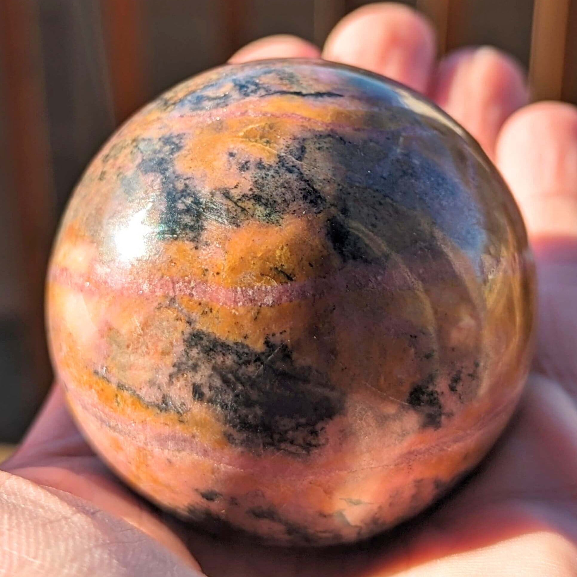 Polished-Rhodonite-Crystal-Sphere-high-quality
