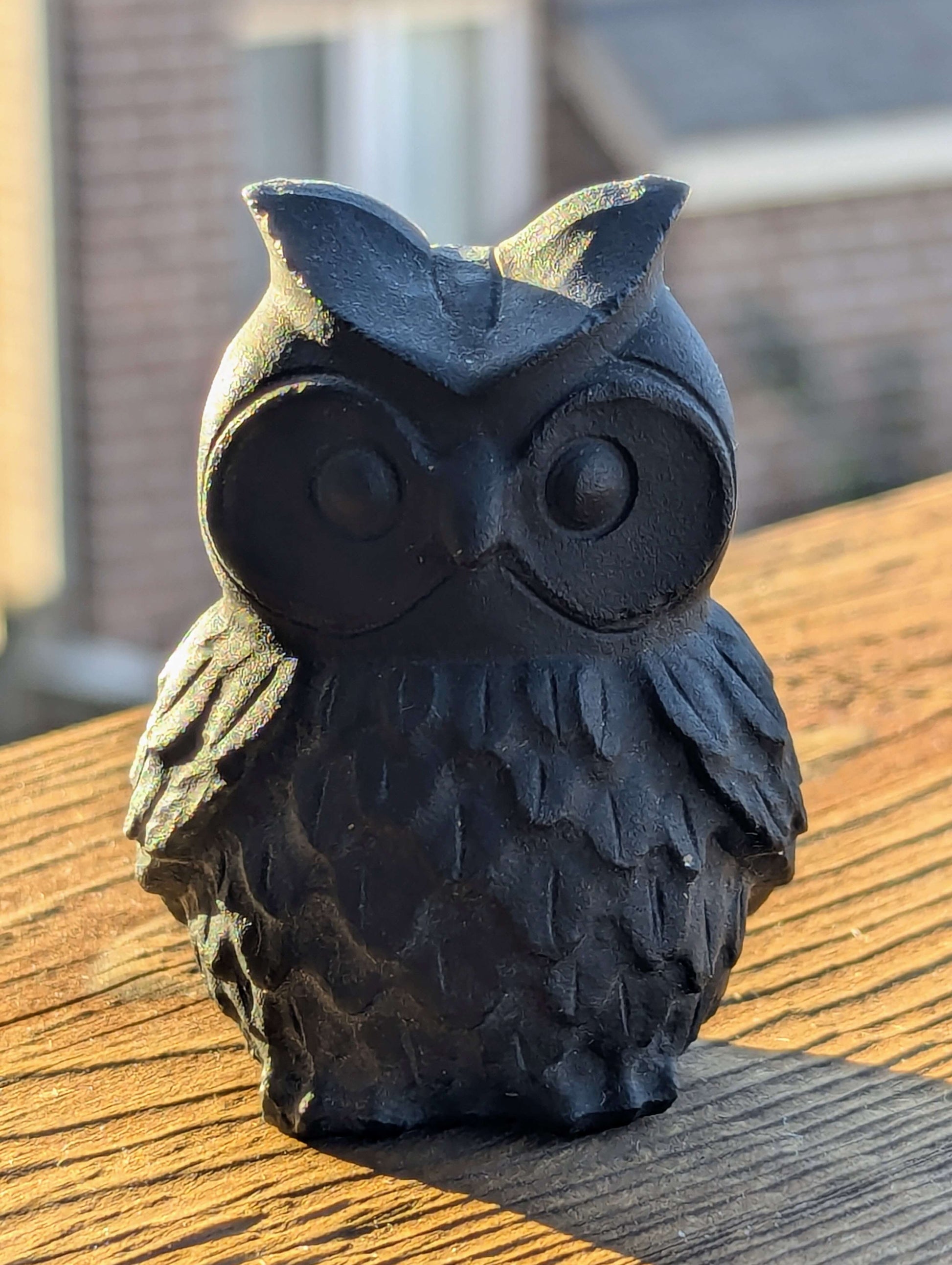 Black-Obsidian-Owl-Carving-on-a-balcony